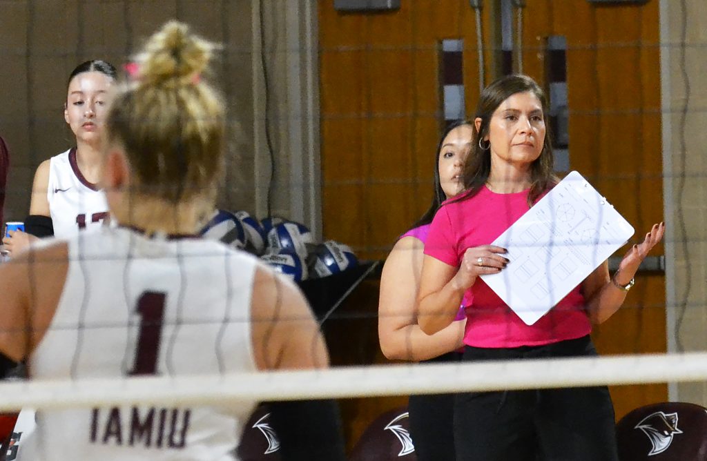 New volleyball coach leads the team during a game